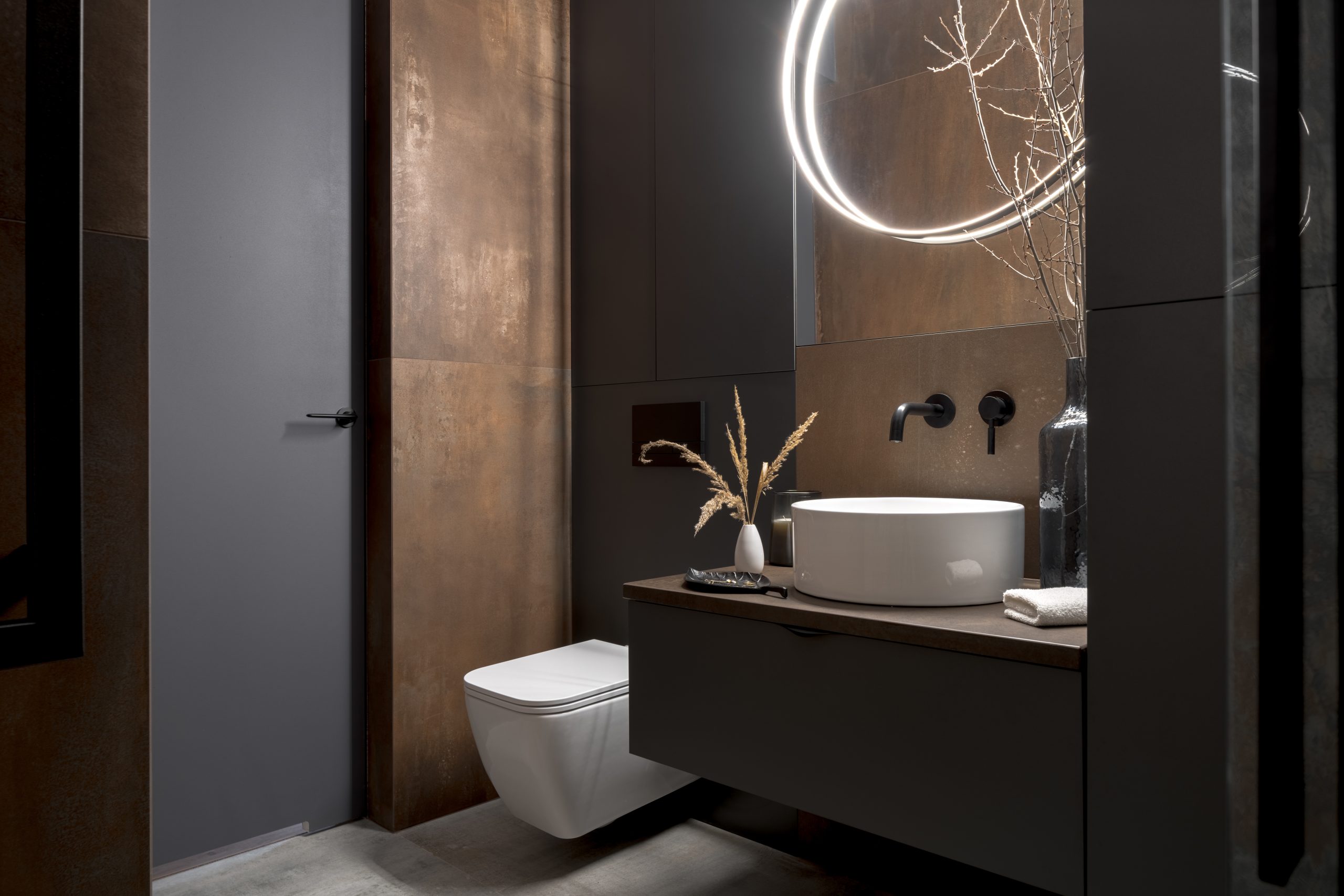 Modern bathroom with rusty tiles Modern bathroom with rusty tiles, stylish lighting and elegant decorations