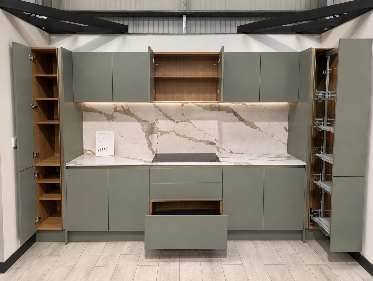 Modern kitchen storage solutions including deep drawers and pull-out larder storage at Leivers & Vale Showroom