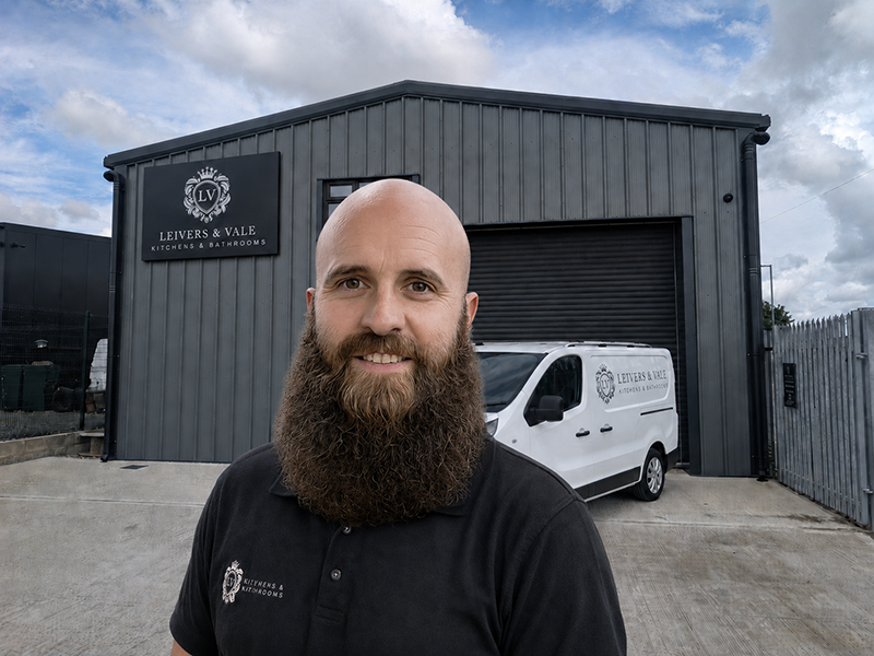 A photo of founding business owner Daryl Leivers in front of the showroom